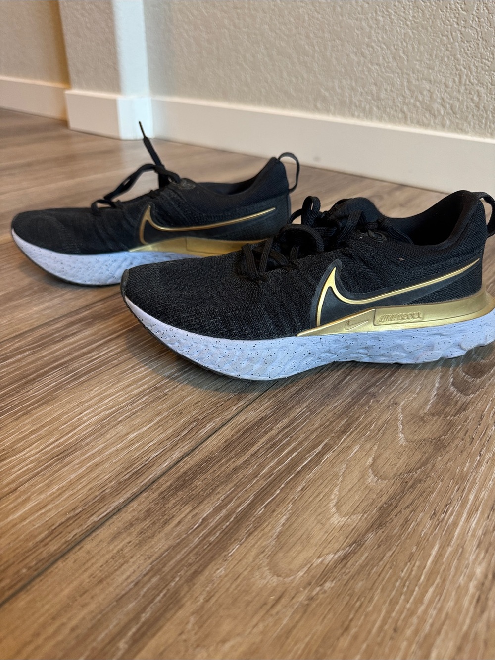 Nike Women’s React Black and Gold Athletic Running Shoes